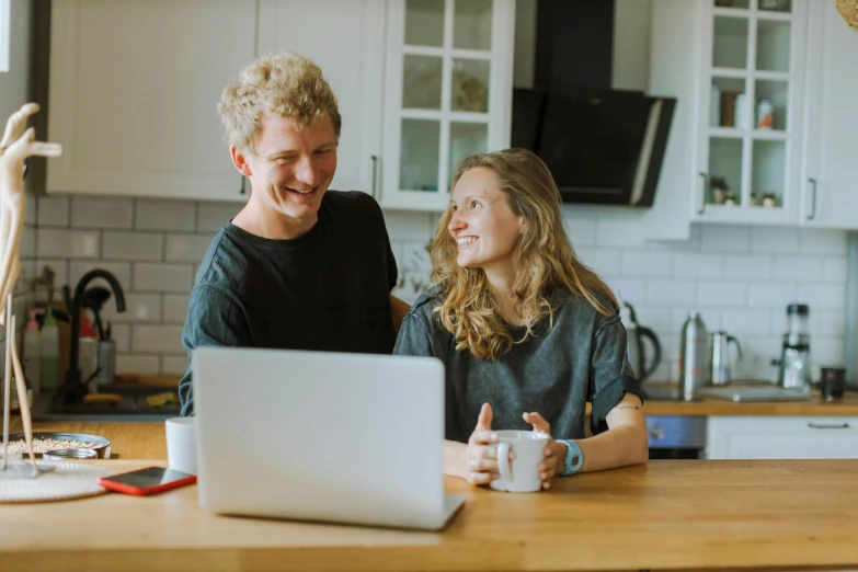 a man and a woman sitting in front of a laptop, pexels contest winner, aussie baristas, on kitchen table, avatar image, cute photo