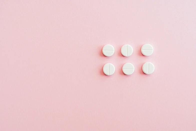 white pills on a pink background, by Emma Andijewska, trending on pexels, white panels, eight eight eight, a round minimalist behind, girls