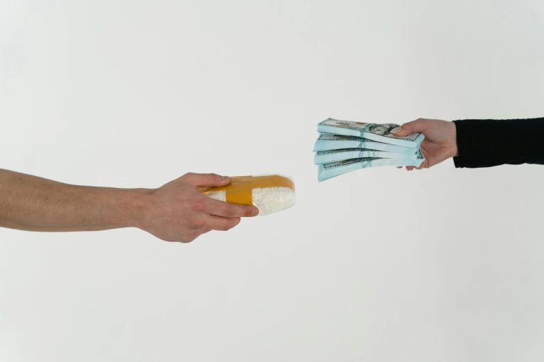 a person handing money to another person's hand, by artist, arbeitsrat für kunst, made of cheese, offering the viewer a pill, dezeen, with a white background