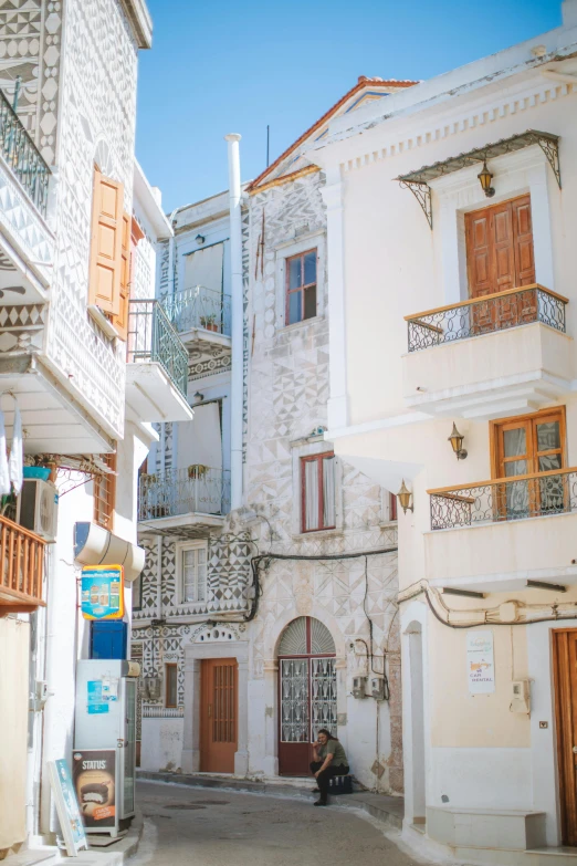 a couple of buildings that are next to each other, renaissance, whitewashed buildings, vacation photo, profile image