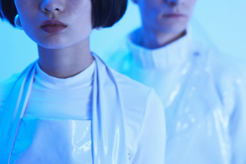 a couple of people standing next to each other, an album cover, unsplash, aestheticism, futuristic fashion show, teamlab, film still from star wars, closeup portrait shot