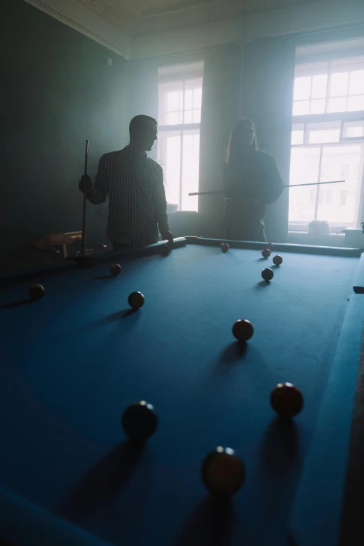 a man standing in front of a pool table, ismail inceoglu and ruan jia, ( ( theatrical ) ), nadav kander, sport