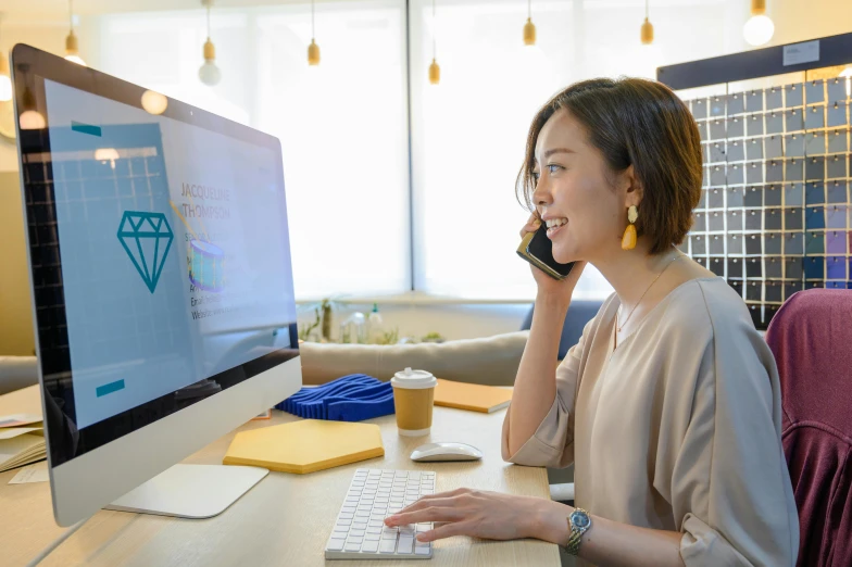 a woman sitting in front of a computer on a desk, inspired by Yuko Tatsushima, pexels contest winner, corporate phone app icon, origami studio 3 design, profile image, 9 9 designs