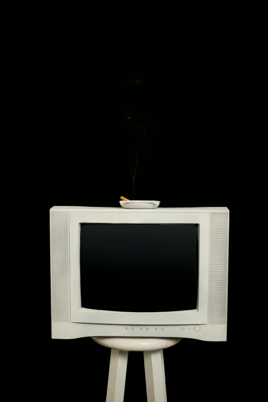 a white television sitting on top of a wooden stand, a cartoon, inspired by Carrie Mae Weems, some smoke and fire, ashtray, 1997 ), ignant