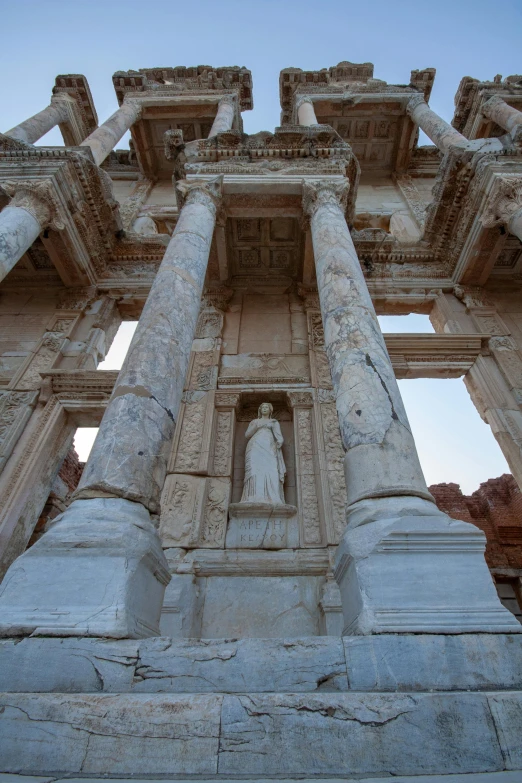 a very tall building with columns in front of it, a statue, turkey, inside her temple, full frame image, multiple stories
