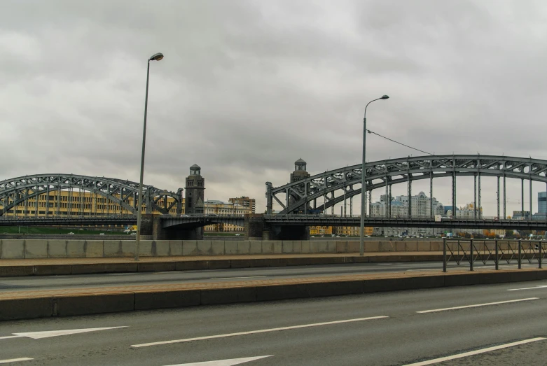 a bridge over a highway on a cloudy day, inspired by Paul Gustav Fischer, pexels contest winner, graffiti, in moscow centre, 2 0 2 2 photo, overcast gray skies, hell gate