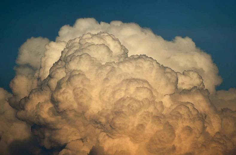 a large cloud that is in the sky, unsplash, precisionism, late afternoon lighting, slide show, tumultuous, burning clouds