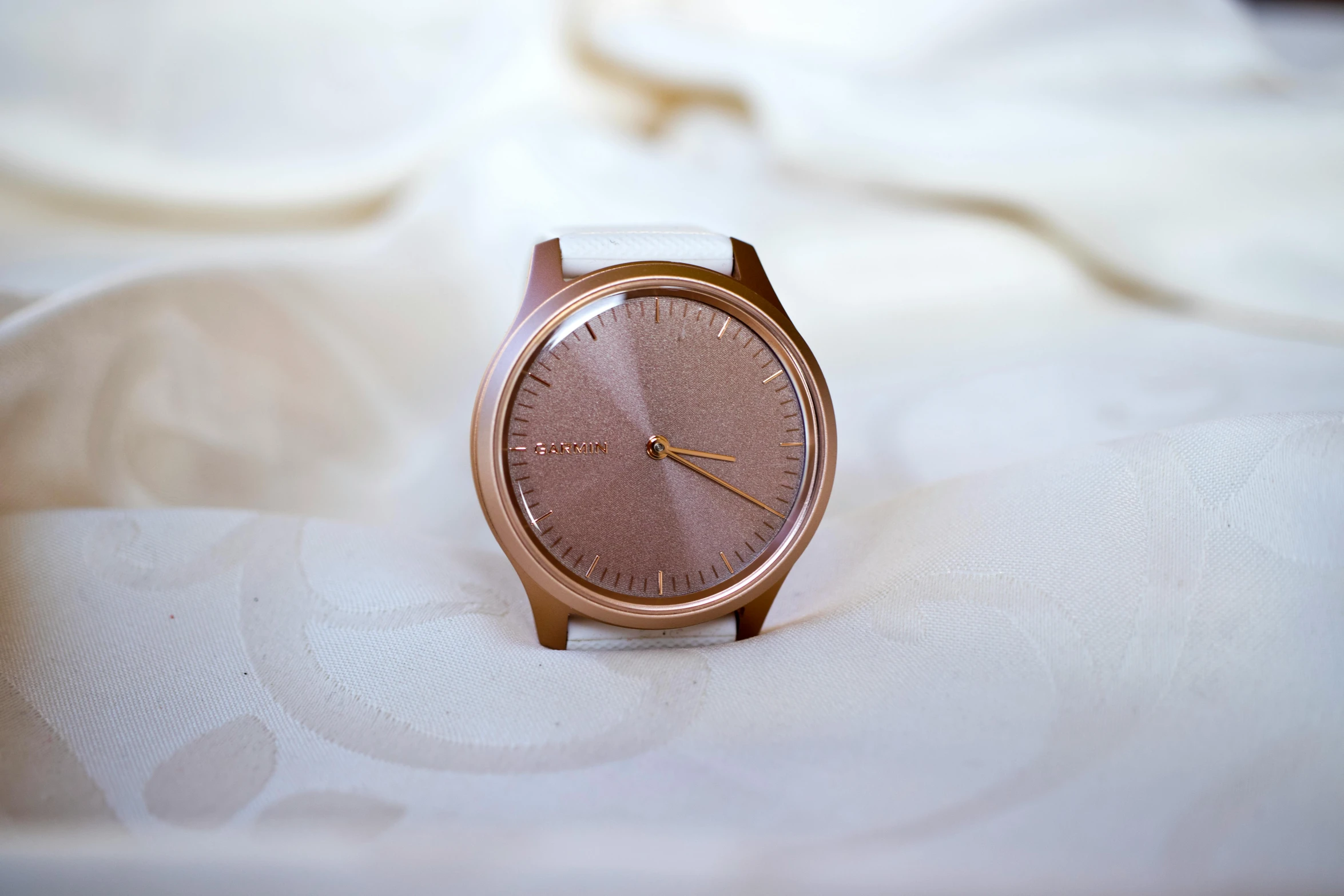 a close up of a wrist watch on a bed, a stipple, by Carey Morris, minimalism, copper, 5k, pink, standing elegantly