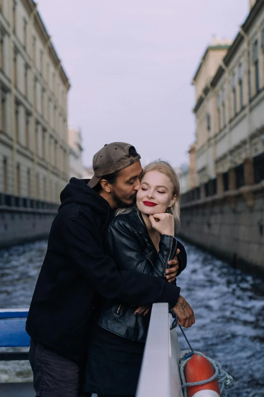 a man and woman standing next to each other on a boat, a photo, by Julia Pishtar, pexels contest winner, renaissance, hugs, canal, angelina stroganova, black