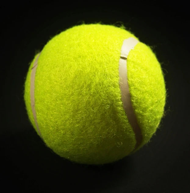 a close up of a tennis ball on a black background, pexels, photorealism, ball shaped accordion sleeve, with neon visor, hyperdetailed!!, medium-shot