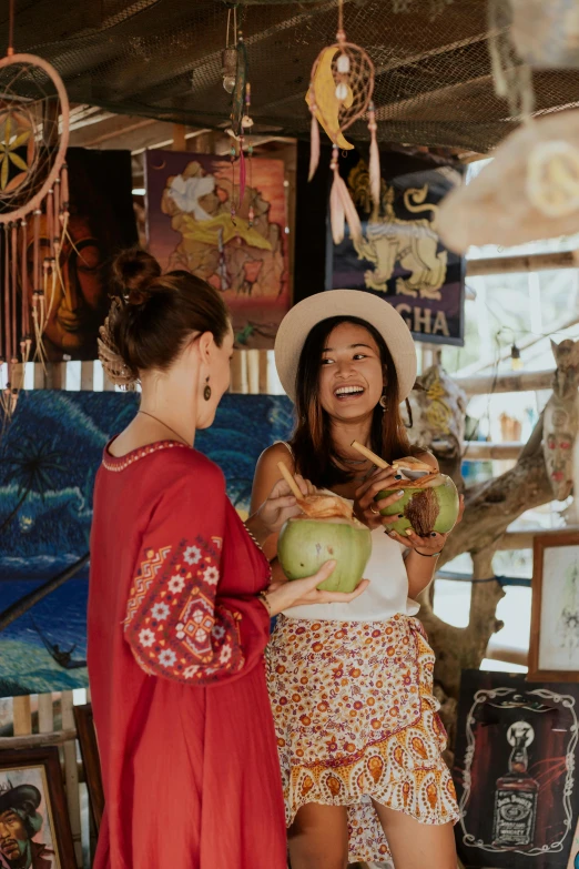 a couple of women standing next to each other, a picture, pexels contest winner, coconuts, crafts and souvenirs, 🎀 🧟 🍓 🧚, boho chic