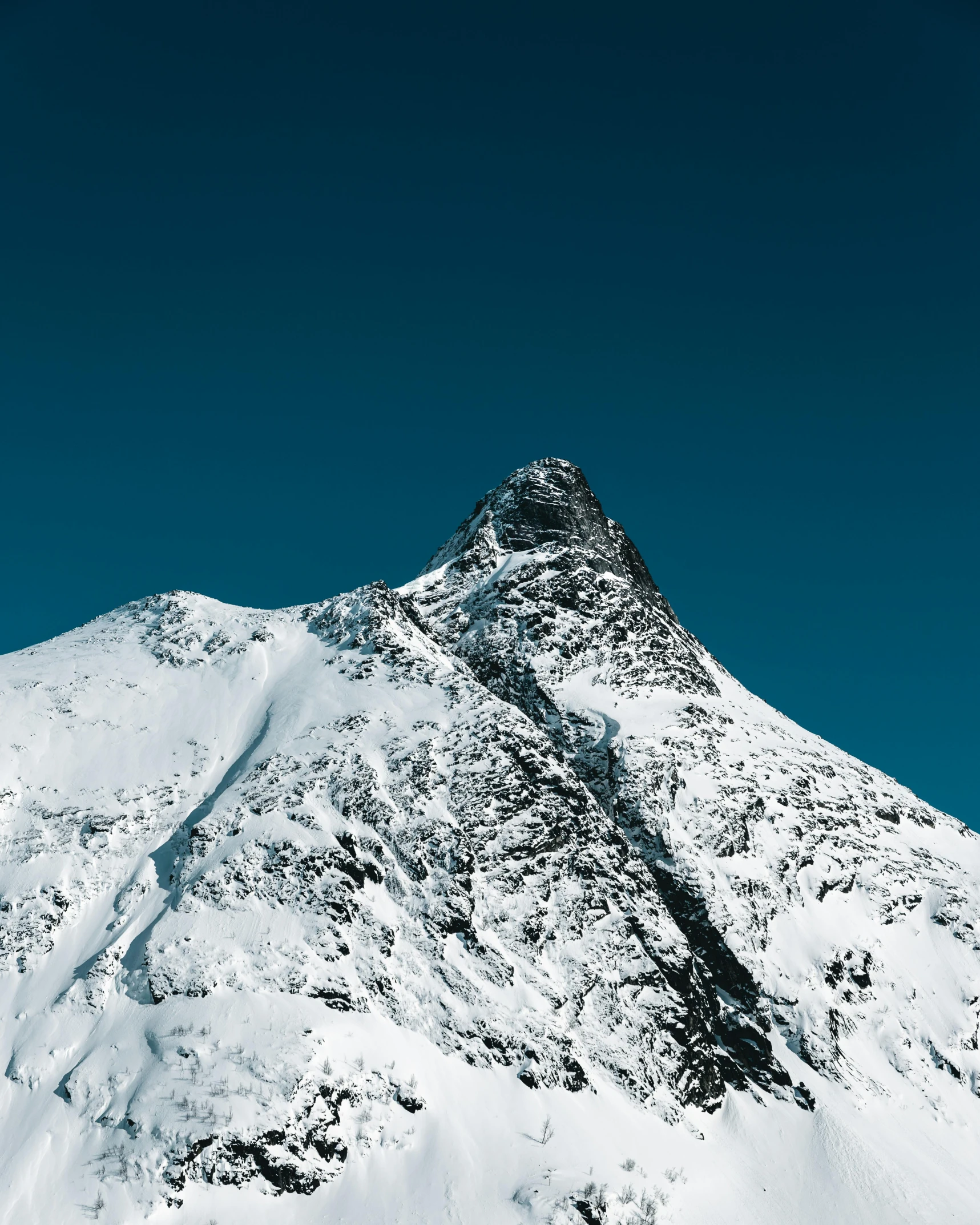 a man flying through the air while riding a snowboard, by Sebastian Spreng, pexels contest winner, minimalism, giant imposing mountain, with snow on its peak, portrait of tall, white and blue