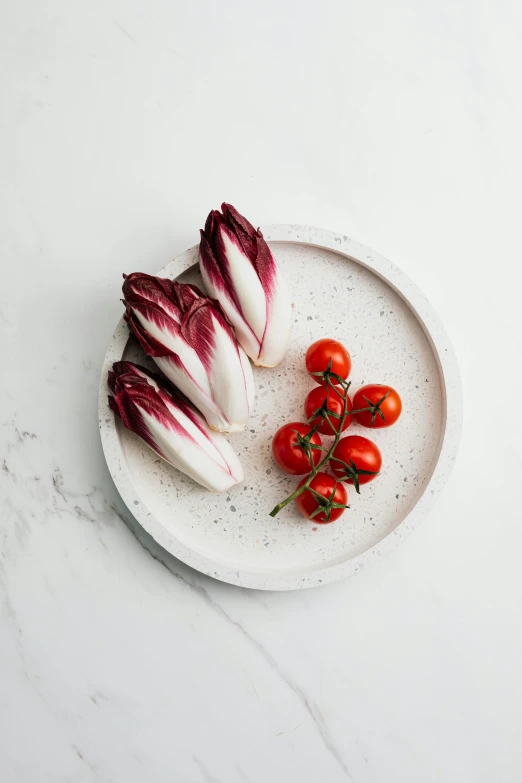 a plate with some red and white radiches on it, inspired by Antonio Rotta, unsplash, white marble, high quality product photo, pointè pose, large tall