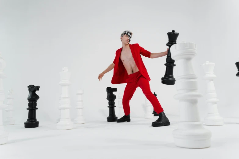 a man in a red suit playing a game of chess, an album cover, inspired by Horace Vernet, pexels contest winner, full body photoshoot, cai xukun, youtube thumbnail, quicksilver