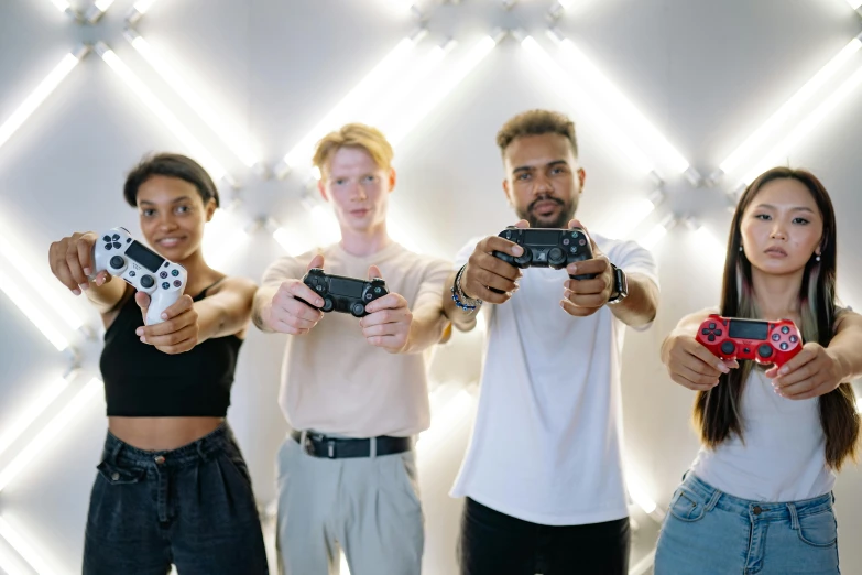 a group of people holding video game controllers, by Emma Andijewska, pexels contest winner, avatar image, any racial background, fully body photo, advertising photo