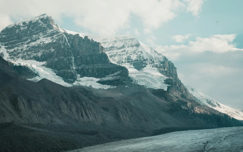 a snow covered mountain with a glacier in the foreground, pexels contest winner, moody : : wes anderson, drumheller, julia hetta, grey