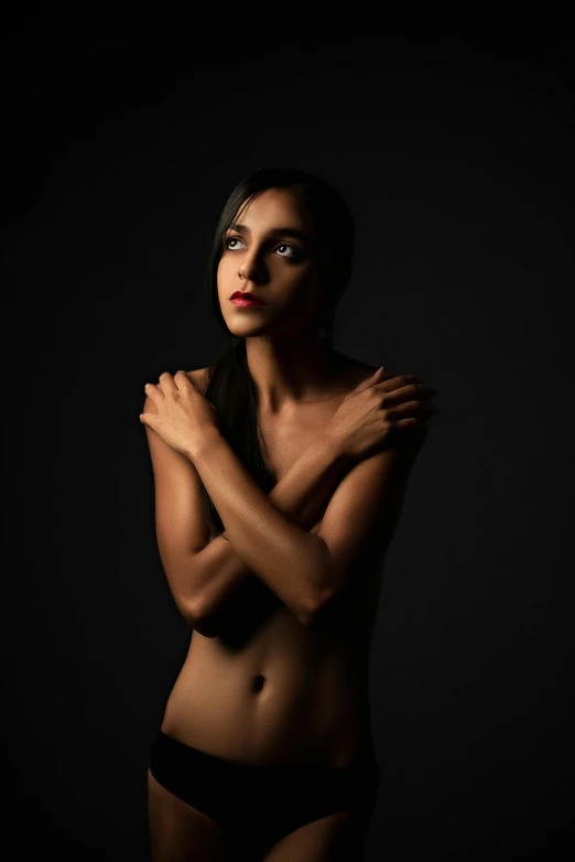 a woman in a black underwear posing for a picture, an album cover, inspired by irakli nadar, featured on cgsociety, indian girl with brown skin, shot at dark with studio lights, concerned expression, taken in the early 2020s