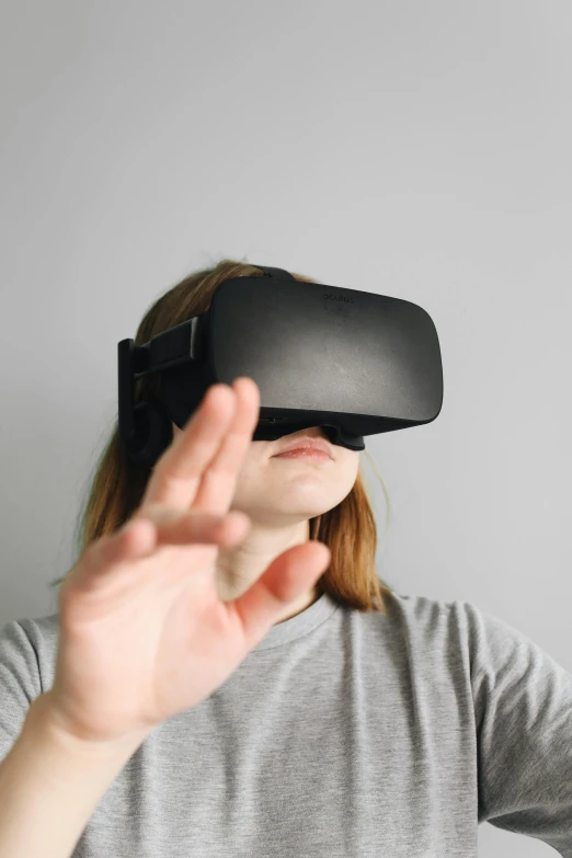 a woman using a virtual reality headset, by Carey Morris, pexels, square, wave a hand at the camera, tech demo, avatar image