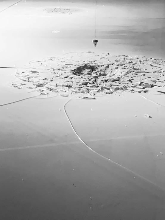 a black and white photo of a hot air balloon, land art, flooded city, salt flats with scattered ruins, ( ( abstract ) ), floating power cables