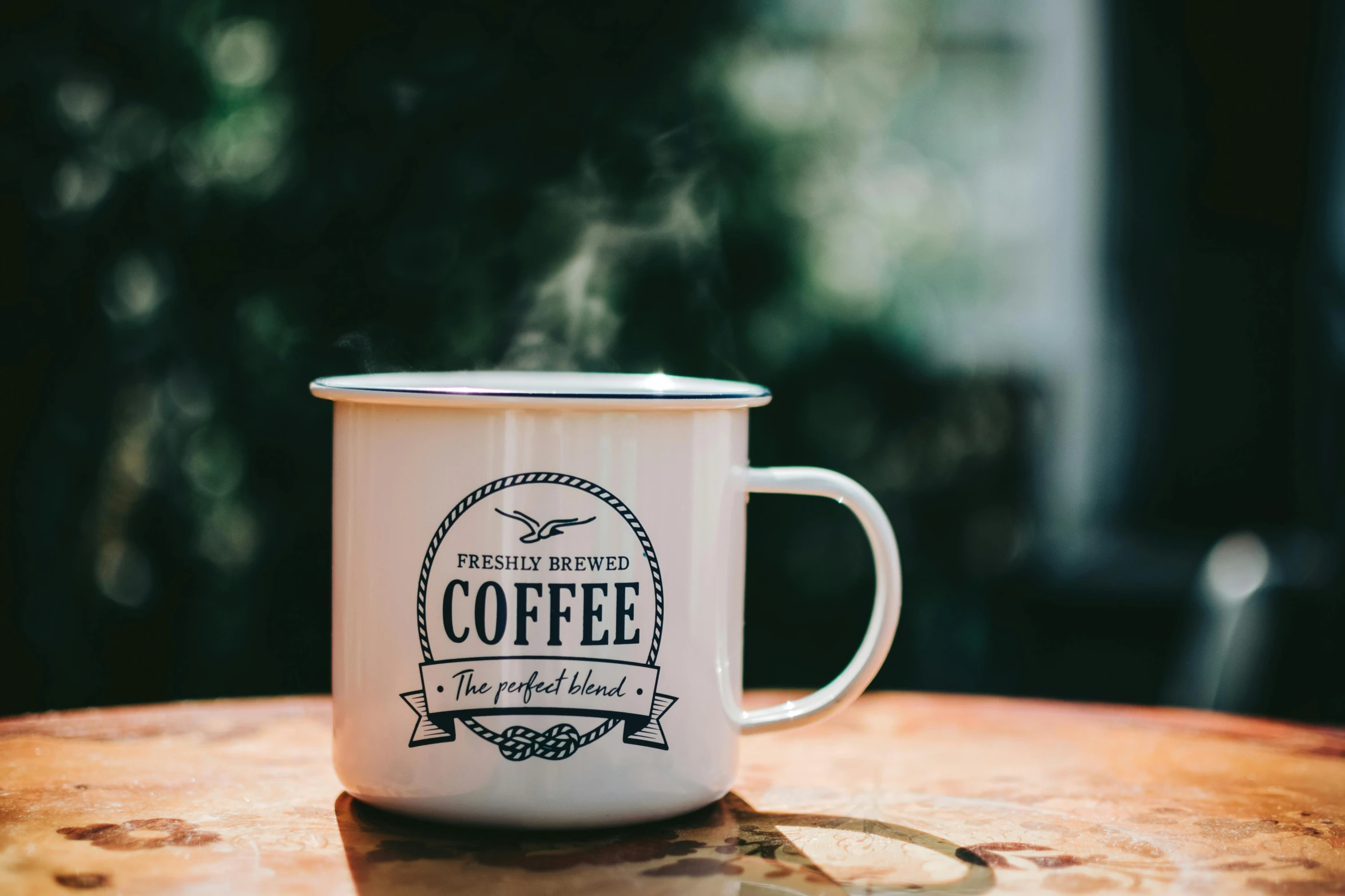 a coffee mug sitting on top of a wooden table, pexels contest winner, private press, logo, background image, vintage photo, high resolution product photo