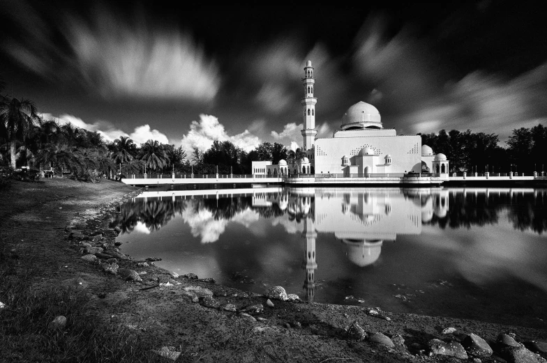 a black and white photo of a mosque, by Ismail Acar, unsplash contest winner, water reflection!!!!!, slow exposure hdr 8 k, holga, idyllic