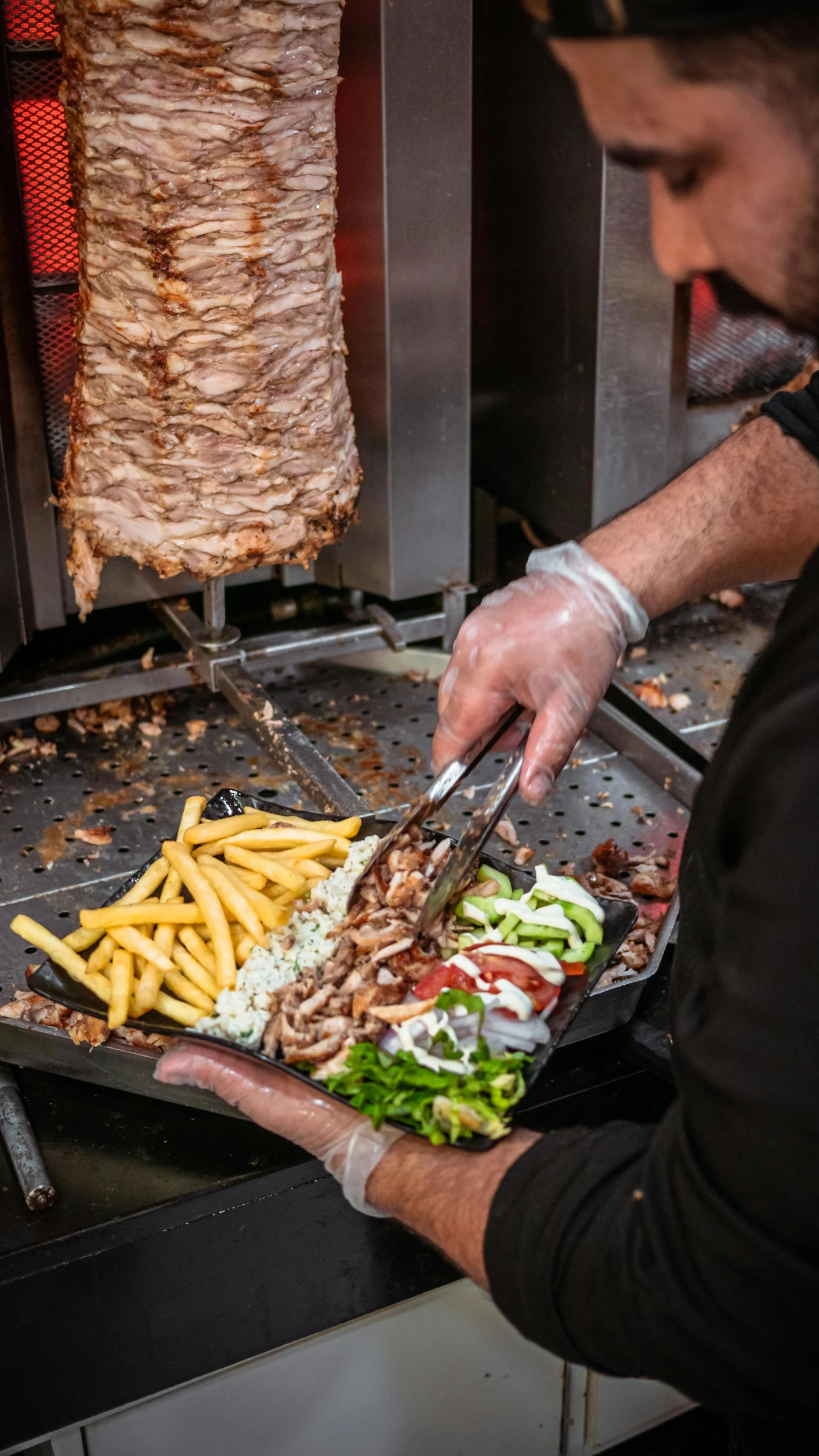 a man preparing food on a grill in a restaurant, by Niko Henrichon, shutterstock, gyro zeppeli, square, 2506921471, hyperdetailed photo