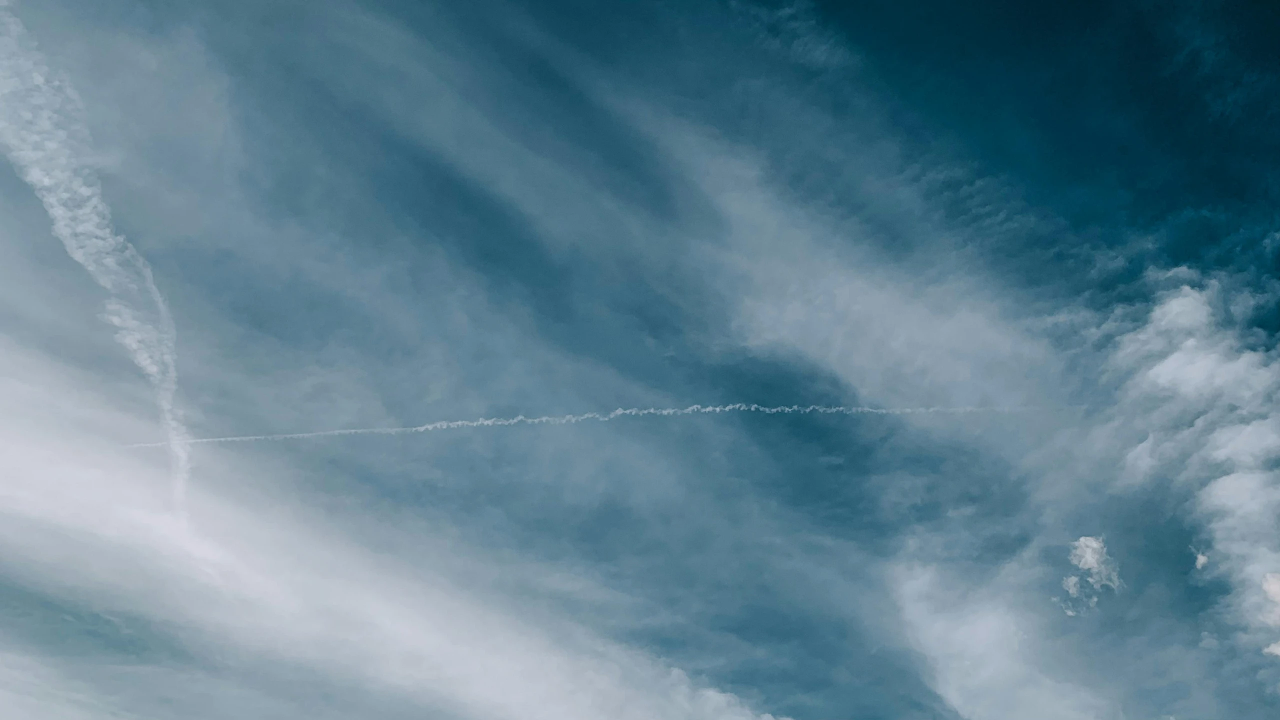 a person is flying a kite in the sky, from the distance, contrails, unsplash 4k, cinematic shot ar 9:16 -n 6 -g