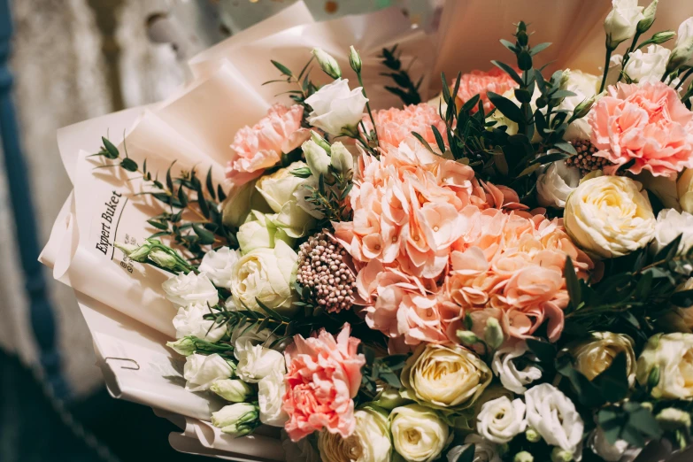 a close up of a bouquet of flowers, pexels, romanticism, in shades of peach, dressed in ornate, celebration, stylised