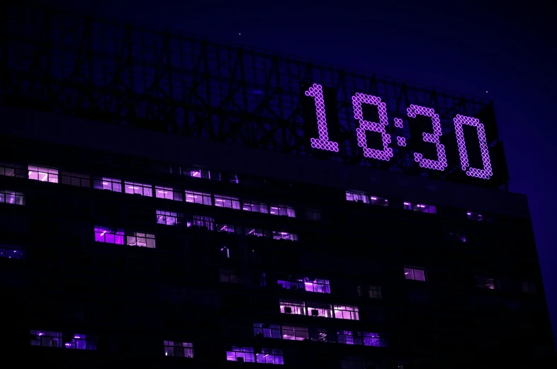a clock that is on the side of a building, inspired by Bruce Munro, ascii art, ((purple)), superbowl, blacklight aesthetic, eight eight eight