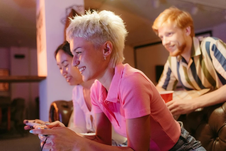 a group of people playing a video game, pexels, happening, girl with short white hair, in a pub, avatar image, pink short hair