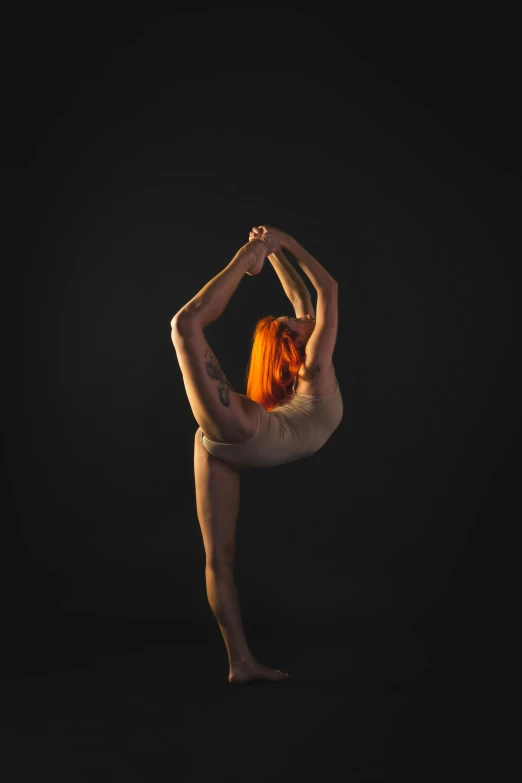 a naked man doing a handstand pose against a black background, an album cover, inspired by Elizabeth Polunin, pexels contest winner, arabesque, madison beer as leeloo, woman is curved, profile image, portrait of a ballerina