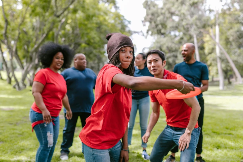 a group of people playing frisbee in a park, a portrait, pexels contest winner, renaissance, wearing a red backwards cap, mix of ethnicities and genders, line dancing at a party, families playing