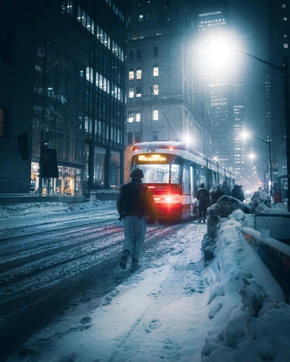 a red bus driving down a snow covered street, by Adam Rex, pexels contest winner, lgbtq, toronto city, people at night, a photo of a man