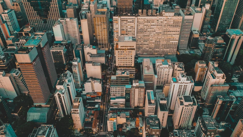 a view of a city from the top of a building, by Luis Miranda, the neat and dense buildings, unsplash 4k, aerial photograph of skyscraper, 2 0 0 0's photo