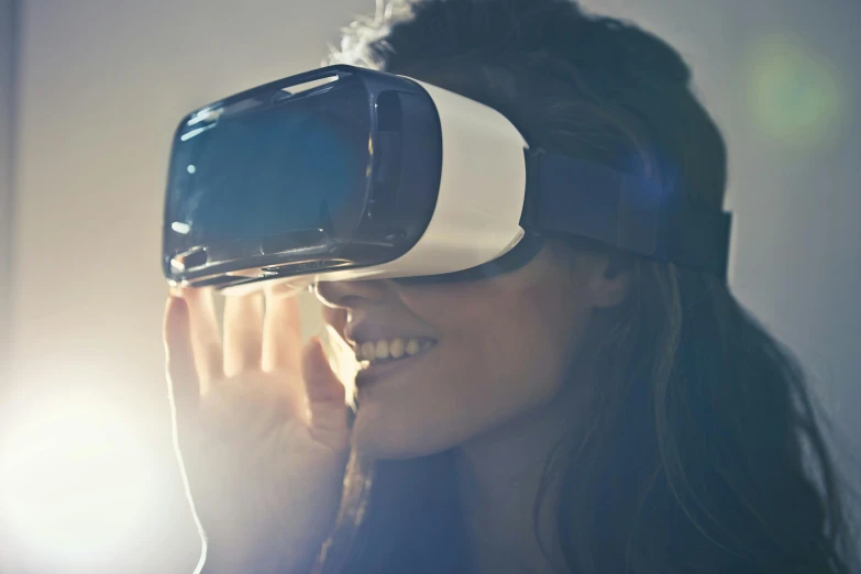 a woman wearing a virtual reality headset, by Joe Bowler, pexels, close up to the screen, advert, v-ray collection, electronics