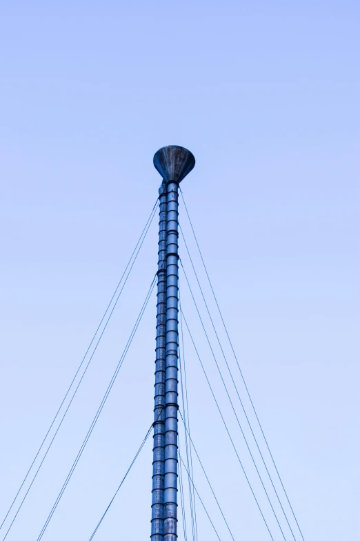 a tall pole with a clock on top of it, by Sven Erixson, unsplash, postminimalism, cables and tubes, sails, blue, mesh structure