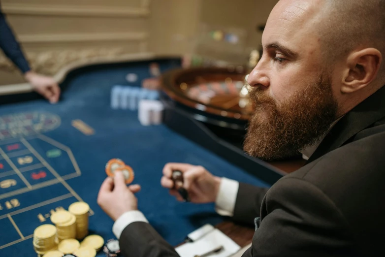 a man in a suit sitting at a casino table, pexels contest winner, renaissance, circle beard, asmongold, strategy game, profile image