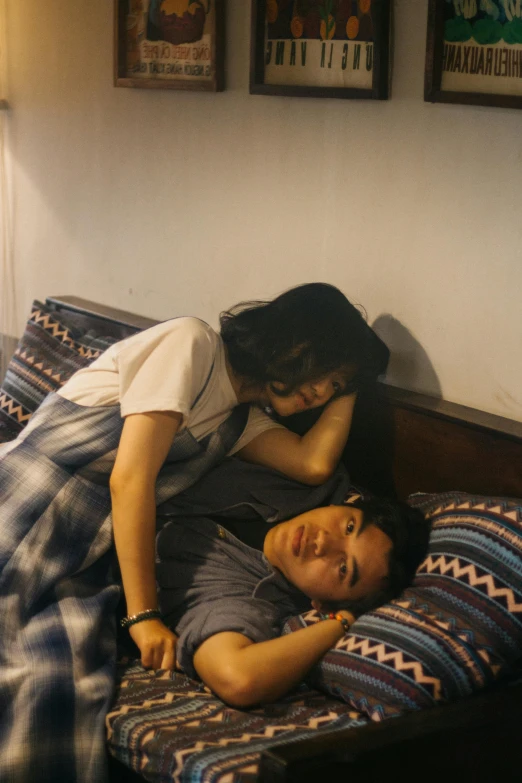 a man and a woman laying on a bed, a picture, inspired by Nan Goldin, unsplash, happening, jakarta, 8 k movie still, scene from live action movie, watch photo