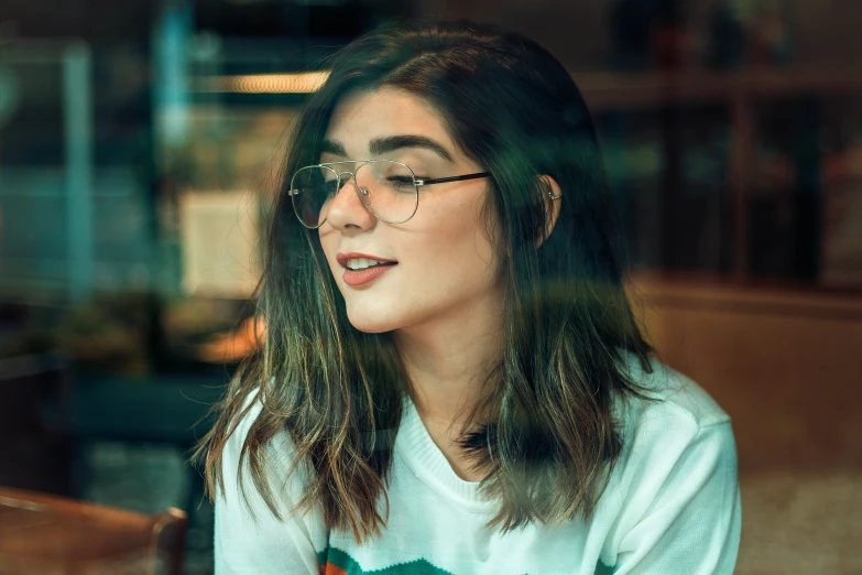 a woman sitting at a table with a plate of food, a picture, inspired by Elsa Bleda, trending on pexels, hyperrealism, square rimmed glasses, girl cute-fine-face, profile image, student