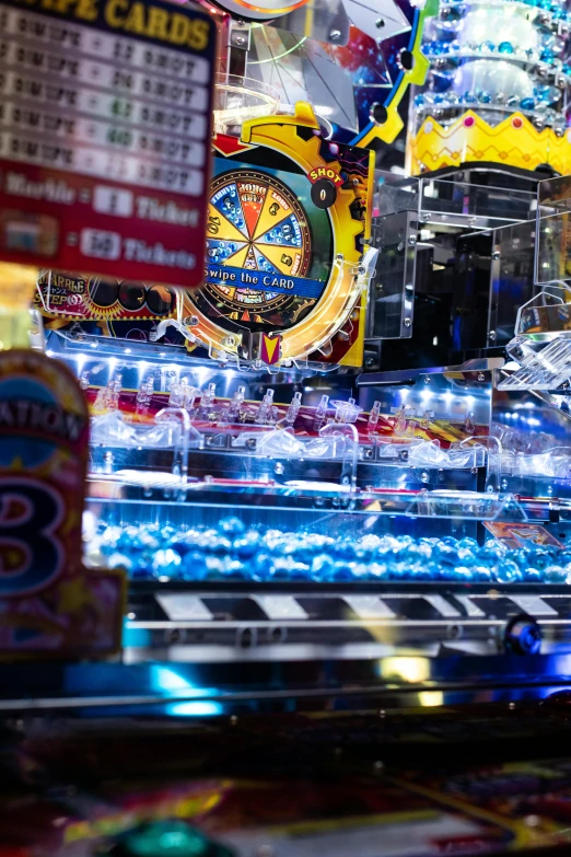 a pinball game machine sitting on top of a table, candy shop in a mall, shot with sony alpha 1 camera, 2 5 6 x 2 5 6 pixels, sliced bread in slots