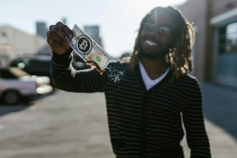 a man with dreadlocks holding a bottle of beer, pexels contest winner, dollar bill, yzy gap, full daylight, high quality product image”