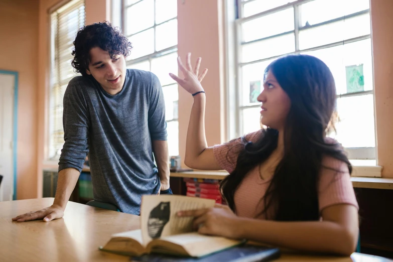 a couple of people that are sitting at a table, pexels contest winner, academic art, arguing, in a school classroom, te pae, reaching