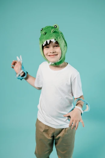 a young boy wearing a green alligator costume, inspired by Adam Rex, trending on pexels, neo-dada, white bandage tape on fists, with wires and bandages, official product photo, hey buddy