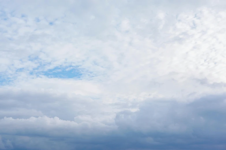 a group of people on a beach flying a kite, unsplash, minimalism, layered stratocumulus clouds, today\'s featured photograph 4k, sky blue, high resolution photograph