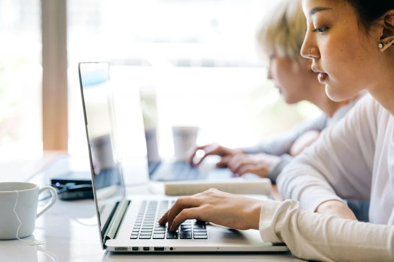 a woman sitting in front of a laptop computer, trending on pexels, school class, lachlan bailey, mid view, 2 5 6 x 2 5 6 pixels