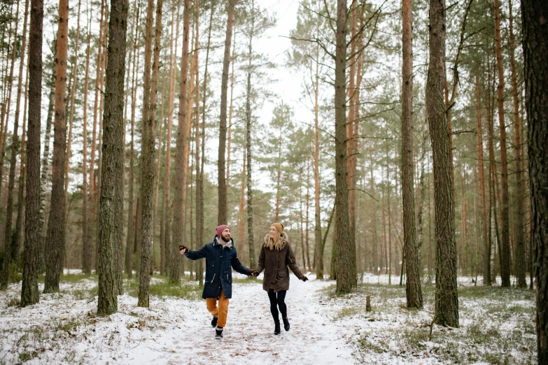 a couple walking through a snowy forest holding hands, pexels, visual art, excited russians, arrendajo in avila pinewood, avatar image, girls