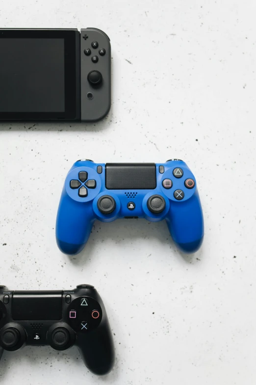 a couple of video game controllers sitting next to each other, a picture, unsplash, minimalism, cobalt blue, instagram post, shot on sony a 7, no - text no - logo