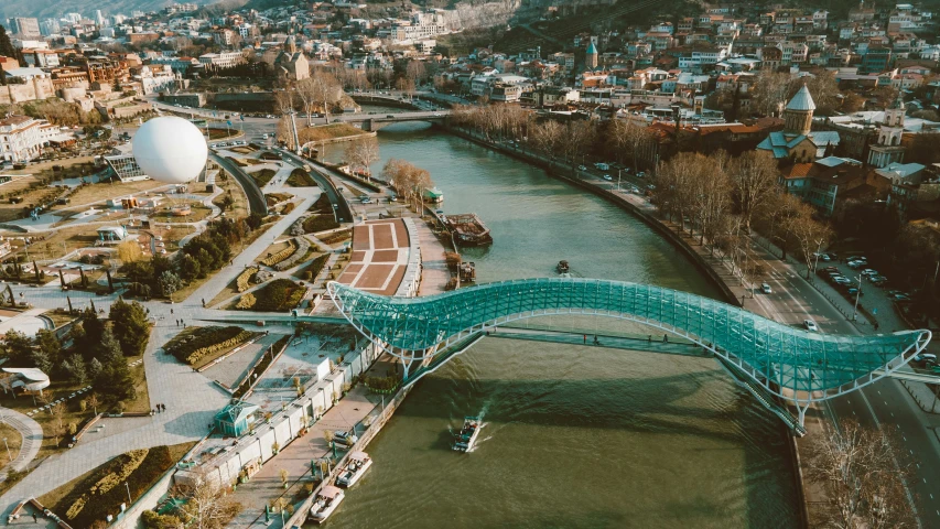 an aerial view of a bridge over a river, pexels contest winner, art nouveau, georgic, urban surroundings, thumbnail, unblur