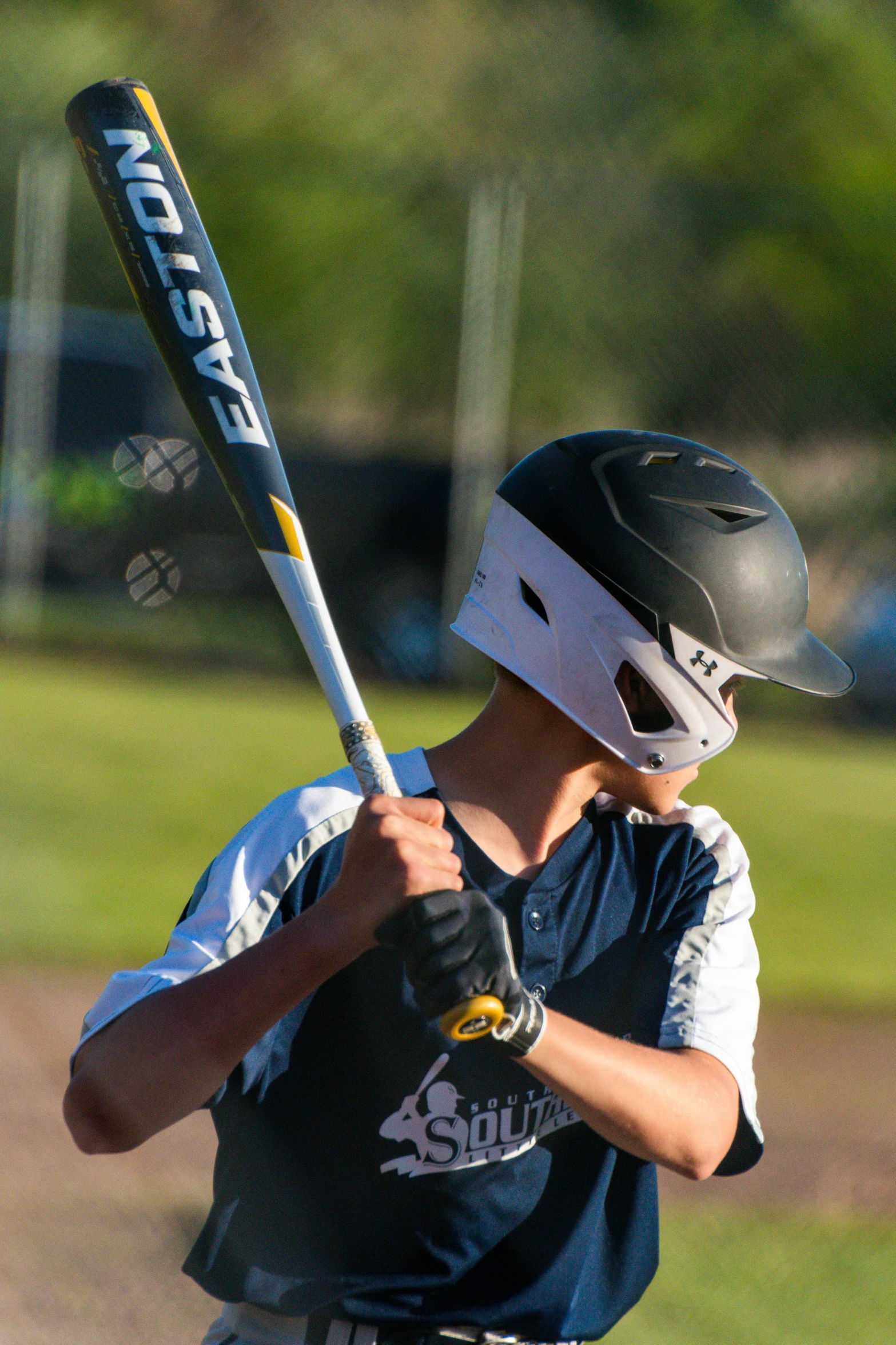 a baseball player holding a bat on a field, ( ( emma lindstrom ) ), helmets, photo taken in 2 0 2 0, square