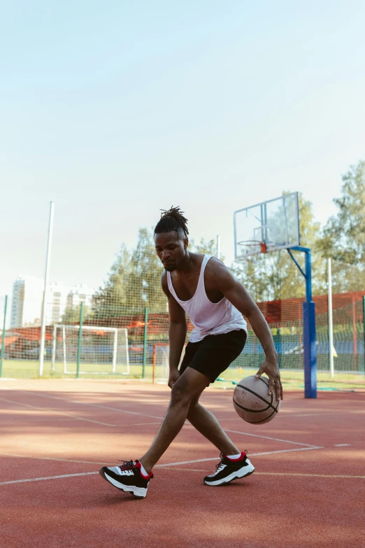 a man dribbling a basketball on a court, by Dan Luvisi, trending on dribble, ( ( dark skin ) ), concentrated, sydney park, rectangle